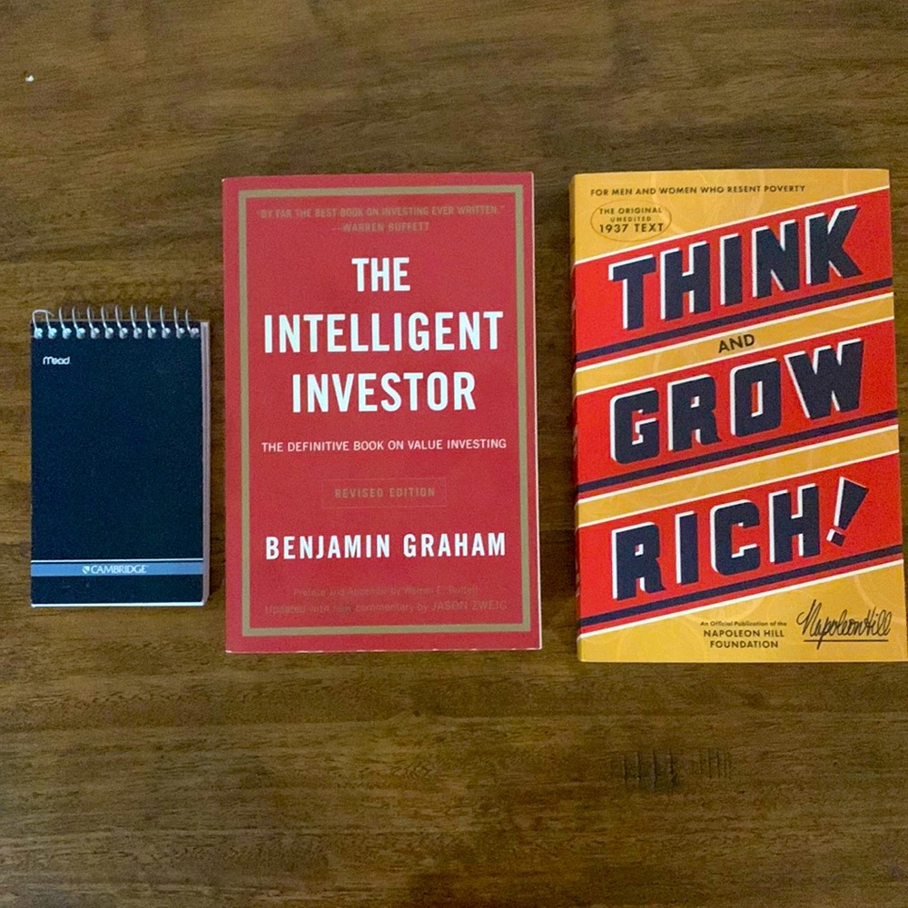 2 books and a small notebook.